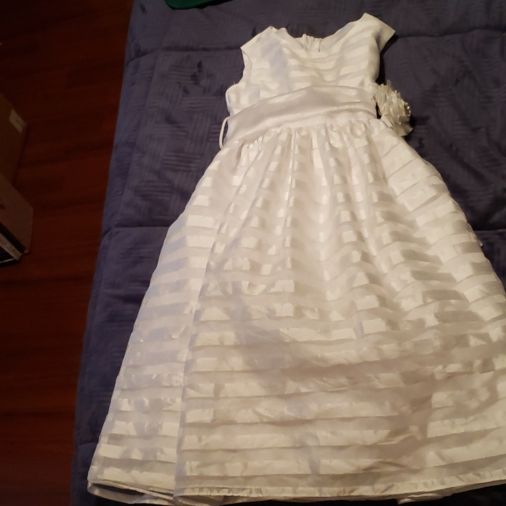 Girl's white white special occasion dress.